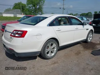 2014 Ford Taurus SEL with VIN 1FAHP2E84EG141795, listed as a IAAI auction lot 42133668 with 154,009 mi miles and . Bid and sale history available at DreamBid. Image 4.