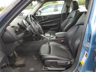 2017 MINI Clubman Cooper S z VIN WMWLU5C5XH2E83566, wystawiony jako Copart lot #57919305 z przebiegiem 89 983 mil mil oraz Tytuł czysty. Historia ofert i sprzedaży dostępna na DreamBid. Obrazek 7.