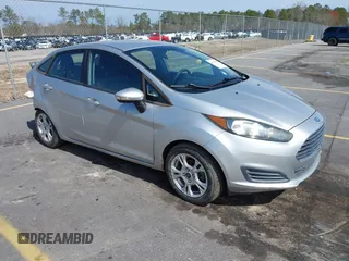 2015 Ford Fiesta SE z VIN 3FADP4BJ5FM199214, wystawiony jako IAAI lot #41734426 z przebiegiem 69 404 mil mil oraz . Historia ofert i sprzedaży dostępna na DreamBid. Obrazek 1.