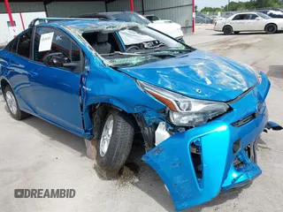 2021 Toyota Prius L Eco with VIN JTDKAMFU7M3141627, listed as a IAAI auction lot 42636551 with 133,719 mi miles and . Bid and sale history available at DreamBid. Image 1.