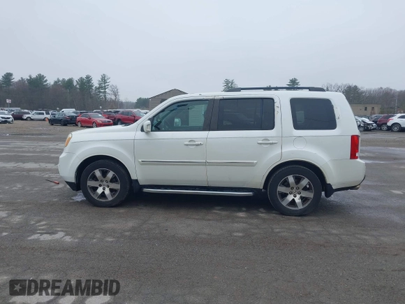 2013 Honda Pilot Touring with VIN 5FNYF4H95DB011661, listed as a IAAI auction lot 42101104 with 298,004 mi miles and . Bid and sale history available at carsss.com. Image 14.