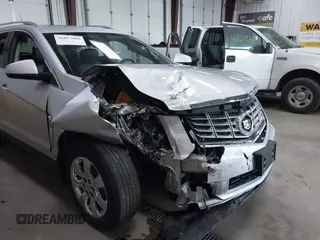 2014 Cadillac SRX Luxury Collection z VIN 3GYFNEE36ES679505, wystawiony jako IAAI lot #41817608 z przebiegiem 62 351 mil mil oraz . Historia ofert i sprzedaży dostępna na DreamBid. Obrazek 6.