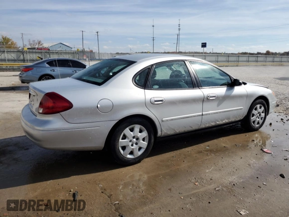 2003 Ford Taurus LX Standard z VIN 1FAFP52U93A159333, wystawiony jako Copart lot #78080944 z przebiegiem 54 652 mil mil oraz Szkoda całkowita • Salvage title. Historia ofert i sprzedaży dostępna na DreamBid. Obrazek 3.