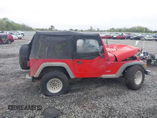 1997 Jeep Wrangler Sport z VIN 1J4FY19S2VP426553, wystawiony jako IAAI lot #41917764 z przebiegiem 154 140 mil mil oraz . Historia ofert i sprzedaży dostępna na DreamBid. Obrazek 13.