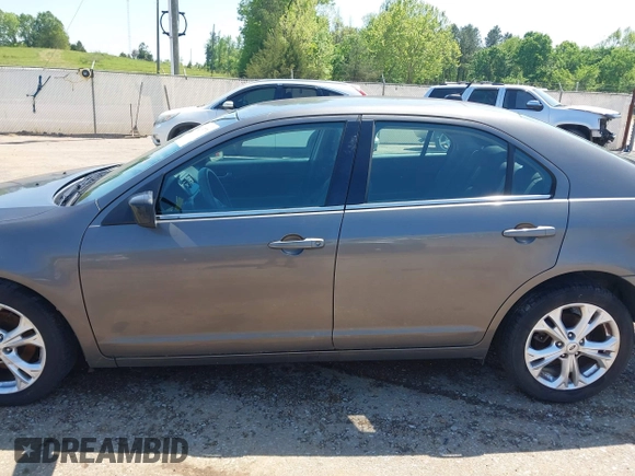 2012 Ford Fusion SE z VIN 3FAHP0HA4CR232641, wystawiony jako IAAI lot #42057070 z przebiegiem 180 793 mil mil oraz . Historia ofert i sprzedaży dostępna na DreamBid. Obrazek 14.