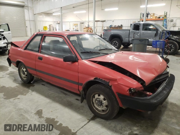 1989 Toyota Tercel z VIN JT2EL31DXK0410350, wystawiony jako Copart lot #79207084 z przebiegiem 189 827 mil mil oraz Szkoda całkowita • Salvage title. Historia ofert i sprzedaży dostępna na DreamBid. Obrazek 4.