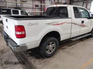 2005 Ford F-150 XLT with VIN 1FTPX14565FB60720, listed as a IAAI auction lot 41728673 with 148,187 mi miles. Bid and sale history available at carsss.com. Image 4.