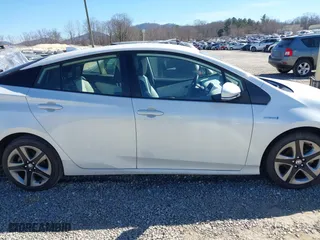 2021 Toyota Prius L Eco with VIN JTDKAMFUXM3142402, listed as a IAAI auction lot 41665484 with 67,416 mi miles. Bid and sale history available at carsss.com. Image 13.