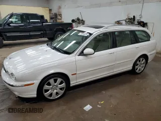 2005 Jaguar X-Type z VIN SAJWA54C35WE42272, wystawiony jako Copart lot #77694924 z przebiegiem 103 899 mil mil oraz Czysty tytuł • Clean title. Historia ofert i sprzedaży dostępna na DreamBid. Obrazek 1.