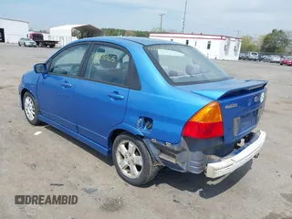 2003 Suzuki Aerio S z VIN JS2RA41S735169831, wystawiony jako IAAI lot #42025965 z przebiegiem 214 238 mil mil oraz . Historia ofert i sprzedaży dostępna na DreamBid. Obrazek 3.