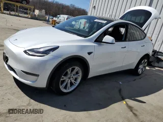 2023 Tesla Model Y Long Range z VIN 7SAYGDEE0PA069003, wystawiony jako Copart lot #49340535 z przebiegiem 26 402 mil mil oraz Szkoda całkowita • Salvage title. Historia ofert i sprzedaży dostępna na DreamBid. Obrazek 1.