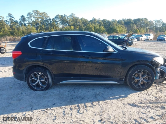 2019 BMW X1 sDrive28i with VIN WBXHU7C52K5L11560, listed as a IAAI auction lot 41354422 with 115,401 mi miles. Bid and sale history available at carsss.com. Image 13.