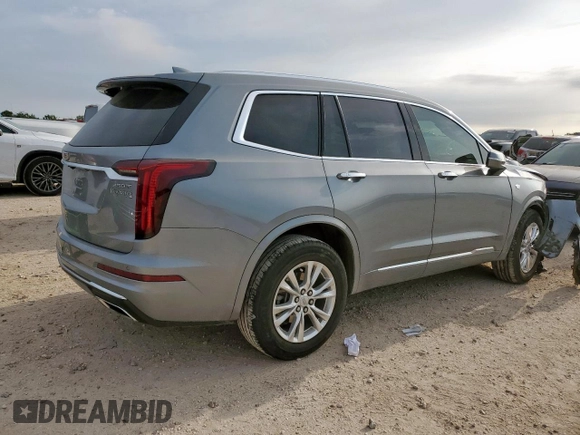 2024 Cadillac XT6 FWD Luxury with VIN 1GYKPAR41RZ700452, listed as a Copart auction lot 57675945 with 27,449 mi miles and Salvage title. Bid and sale history available at DreamBid. Image 3.