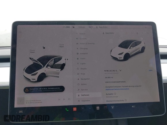 2021 Tesla Model Y Standard Range with VIN 5YJYGDED9MF121828, listed as a IAAI auction lot 42119518 with 34,454 mi miles and . Bid and sale history available at carsss.com. Image 7.