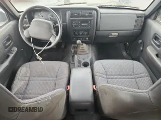 1999 Jeep Cherokee z VIN 1J4FF28P4XL560533, wystawiony jako Copart lot #59180605 z przebiegiem 190 262 mil mil oraz Czysty tytuł • Clean title. Historia ofert i sprzedaży dostępna na DreamBid. Obrazek 8.