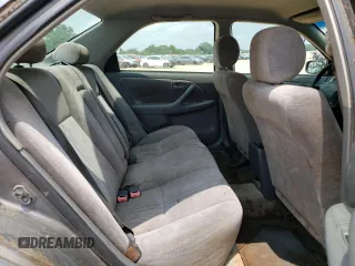 1999 Toyota Camry LE z VIN JT2BF22K5X0208248, wystawiony jako Copart lot #59916165 z przebiegiem 329 883 mil mil oraz Szkoda całkowita • Salvage title. Historia ofert i sprzedaży dostępna na DreamBid. Obrazek 10.