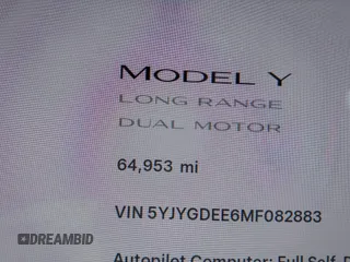 2021 Tesla Model Y Long Range with VIN 5YJYGDEE6MF082883, listed as a IAAI auction lot 42078807 with 64,953 mi miles. Bid and sale history available at carsss.com. Image 16.