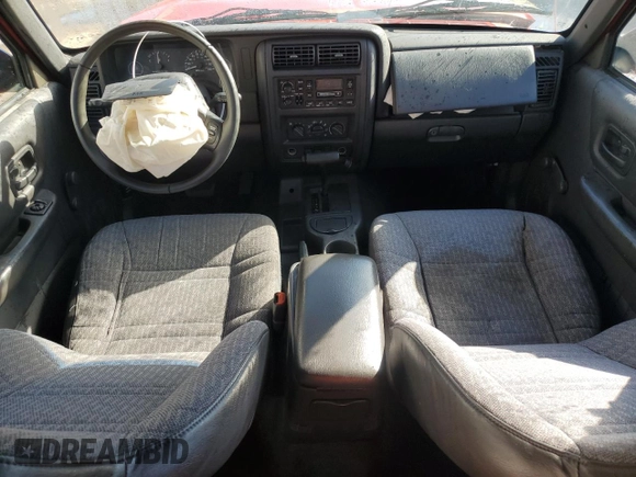 1999 Jeep Cherokee SE with VIN 1J4FT28S6XL515896, listed as a Copart auction lot 83745444 with 192,406 mi miles and Salvage title. Bid and sale history available at DreamBid. Image 8.