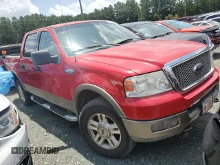 2004 Ford F-150 XLT with VIN 1FTPW14504KD65703, listed as a Copart auction lot 58792215 with 303,083 mi miles and Salvage title. Bid and sale history available at DreamBid. Image 4.