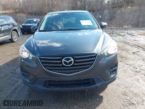 2016 Mazda CX-5 Sport with VIN JM3KE4BY5G0829927, listed as a IAAI auction lot 41678552 with 121,476 mi miles. Bid and sale history available at carsss.com. Image 12.