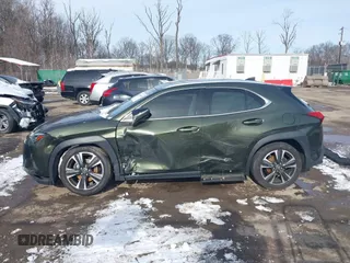 2021 Lexus UX with VIN JTHX3JBH9M2040066, listed as a IAAI auction lot 41256663 with 48,638 mi miles. Bid and sale history available at carsss.com. Image 14.