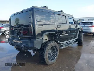 2003 Hummer H2 z VIN 5GRGN23UX3H112173, wystawiony jako IAAI lot #41093359 z przebiegiem Nie podano mil oraz . Historia ofert i sprzedaży dostępna na DreamBid. Obrazek 4.