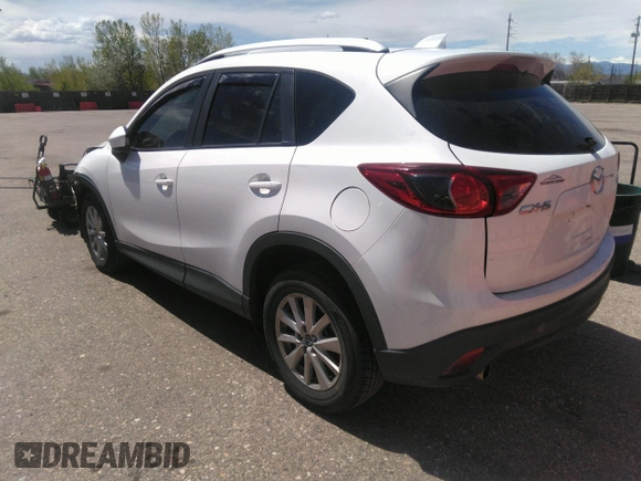 2014 Mazda CX-5 Touring with VIN JM3KE2CY7E0364311, listed as a IAAI auction lot 42108176 with 90,506 mi miles and . Bid and sale history available at DreamBid. Image 3.