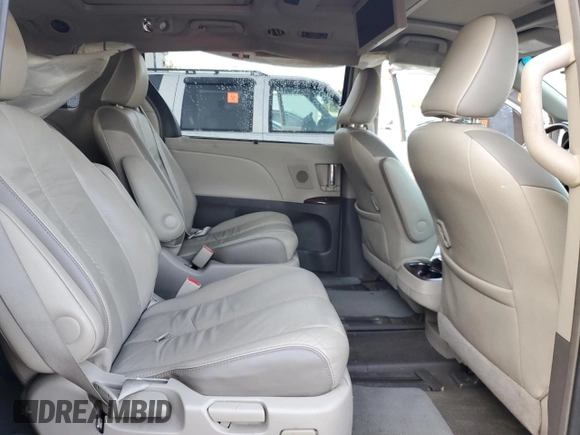2012 Toyota Sienna XLE AAS z VIN 5TDYK3DC7CS220708, wystawiony jako Copart lot #58295075 z przebiegiem 154 529 mil mil oraz Szkoda całkowita • Salvage title. Historia ofert i sprzedaży dostępna na DreamBid. Obrazek 11.