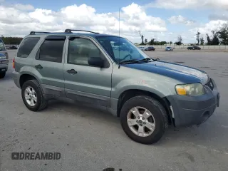 2005 Ford Escape XLT with VIN 1FMYU03135KE33198, listed as a Copart auction lot 75321764 with 169,733 mi miles and Salvage Title. Bid and sale history available at carsss.com. Image 4.