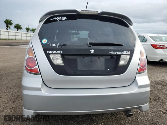 2006 Suzuki Aerio Premium z VIN JS2RC62H265351207, wystawiony jako Copart lot #74980534 z przebiegiem 64 199 mil mil oraz Nie do naprawy • Non repairable. Historia ofert i sprzedaży dostępna na DreamBid. Obrazek 6.