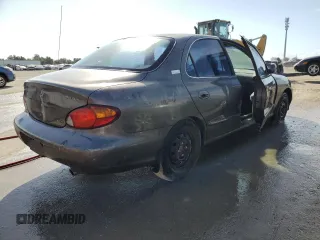 2000 Hyundai Elantra GLS z VIN KMHJF35F6YU912049, wystawiony jako Copart lot #64330472 z przebiegiem 222 733 mil mil oraz Nie do naprawy • Non repairable. Historia ofert i sprzedaży dostępna na DreamBid. Obrazek 4.