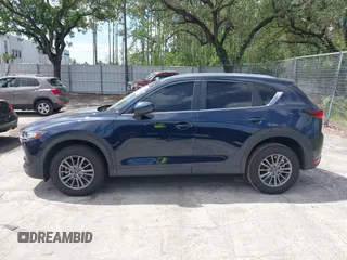 2017 Mazda CX-5 Touring with VIN JM3KFACL0H0227615, listed as a IAAI auction lot 42063618 with 72,291 mi miles. Bid and sale history available at carsss.com. Image 14.