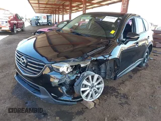 2016 Mazda CX-5 Sport with VIN JM3KE4BY8G0829002, listed as a IAAI auction lot 42553846 with 103,231 mi miles and . Bid and sale history available at DreamBid. Image 18.