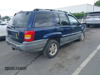 2002 Jeep Grand Cherokee Laredo with VIN 1J4GX48S02C125258, listed as a IAAI auction lot 42388724 with 295,270 mi miles and . Bid and sale history available at DreamBid. Image 4.