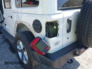 2019 Jeep Wrangler Unlimited Sahara with VIN 1C4HJXEN5KW509806, listed as a IAAI auction lot 42071325 with 95,549 mi miles and . Bid and sale history available at DreamBid. Image 21.