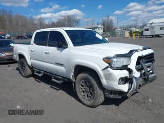 2020 Toyota Tacoma SR5 with VIN 3TMCZ5AN5LM339977, listed as a IAAI auction lot 41886937 with 94,986 mi miles and . Bid and sale history available at DreamBid. Image 1.