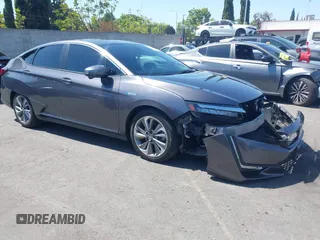 2018 Honda Clarity Touring z VIN JHMZC5F32JC024117, wystawiony jako IAAI lot #42312916 z przebiegiem 27 122 mil mil oraz . Historia ofert i sprzedaży dostępna na DreamBid. Obrazek 1.