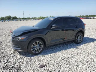 2021 Mazda CX-5 Signature with VIN JM3KFBEY5M0439676, listed as a Copart auction lot 52823285 with 41,811 mi miles and Non Repairable. Bid and sale history available at carsss.com. Image 1.