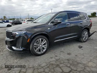 2023 Cadillac XT6 FWD Premium Luxury with VIN 1GYKPCRS5PZ220616, listed as a Copart auction lot 56913725 with 25,860 mi miles and Salvage title. Bid and sale history available at DreamBid. Image 1.