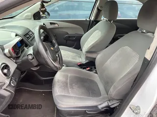 2014 Chevrolet Sonic LS with VIN 1G1JA5SG3E4180849, listed as a IAAI auction lot 42127842 with 113,056 mi miles and . Bid and sale history available at DreamBid. Image 1.