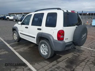2002 Jeep Liberty Sport with VIN 1J4GL48K92W268896, listed as a IAAI auction lot 41915144 with 102,706 mi miles. Bid and sale history available at carsss.com. Image 3.