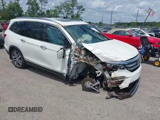 2017 Honda Pilot Touring with VIN 5FNYF5H91HB032650, listed as a IAAI auction lot 42105336 with Not provided miles and . Bid and sale history available at DreamBid. Image 1.