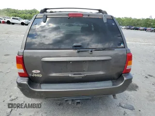 1999 Jeep Grand Cherokee Limited with VIN 1J4GW68S6XC713297, listed as a Copart auction lot 55264384 with 98,912 mi miles and Salvage Title. Bid and sale history available at carsss.com. Image 6.