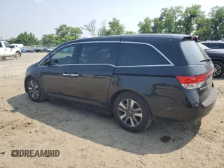 2014 Honda Odyssey Touring with VIN 5FNRL5H91EB015162, listed as a Copart auction lot 60643135 with 176,898 mi miles and Salvage title. Bid and sale history available at DreamBid. Image 2.