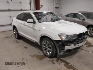 2016 BMW X4 xDrive28i with VIN 5UXXW3C55G0M89736, listed as a IAAI auction lot 41561238 with 125,550 mi miles and . Bid and sale history available at DreamBid. Image 1.