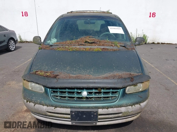 1999 Plymouth Voyager Grand SE z VIN 1P4GP44G0XB579719, wystawiony jako IAAI lot #41981925 z przebiegiem 163 940 mil mil oraz . Historia ofert i sprzedaży dostępna na DreamBid. Obrazek 6.