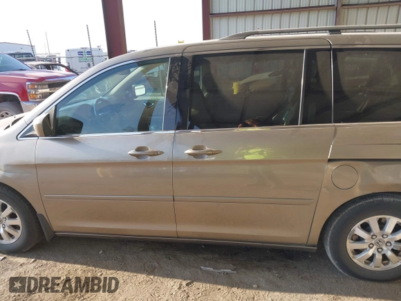 2010 Honda Odyssey EX-L with VIN 5FNRL3H79AB048049, listed as a IAAI auction lot 42055090 with 142,736 mi miles. Bid and sale history available at carsss.com. Image 14.