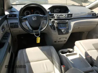 2014 Honda Odyssey Touring with VIN 5FNRL5H99EB088859, listed as a Copart auction lot 54828555 with 147,147 mi miles and Salvage Title. Bid and sale history available at DreamBid. Image 8.
