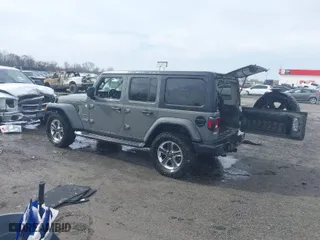 2019 Jeep Wrangler Unlimited Sahara Altitude with VIN 1C4HJXEG0KW518169, listed as a IAAI auction lot 41571720 with 155,981 mi miles. Bid and sale history available at carsss.com. Image 3.