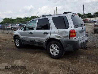 2005 Ford Escape Hybrid with VIN 1FMCU96H55KC74059, listed as a Copart auction lot 57065685 with 154,807 mi miles and Salvage title. Bid and sale history available at DreamBid. Image 2.